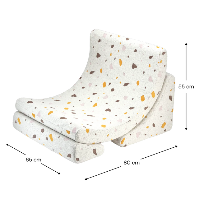 Sillón infantil tejido terrazo Luna con acabado blanco, tejido en ambiente de estilo nórdico